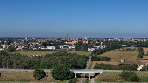 Panoramic view of Cremona skyline and agricultural landscape near a Northern Italian city under a
