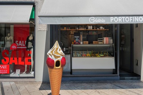 Shop window with swimwear 70% SALE, and gelateria, Dornbirn, Vorarlberg, Austria