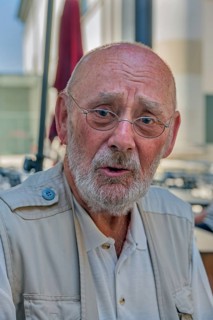 Elderly gentleman with beard and glasses, doubtful look, Dornbirn, Vorarlberg, Austria