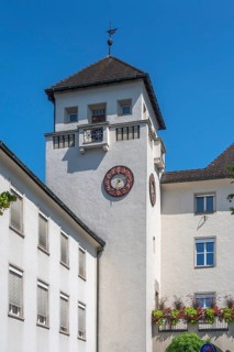 Light grey façade with tower, clock and floral decorations, Dornbirn, Vorarlberg, Austria
