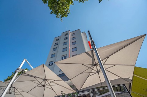 Light grey sunshades in front of a high-rise building, Dornbirn, Vorarlberg, Austria