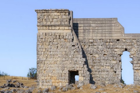 08/21/2025 Ronda, Malaga, Spain Main facade of the ruins of the Roman amphitheater of Acinipo with