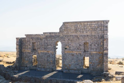 08/21/2025 Ronda, Malaga, Spain Main facade of the ruins of the Roman amphitheater of Acinipo with