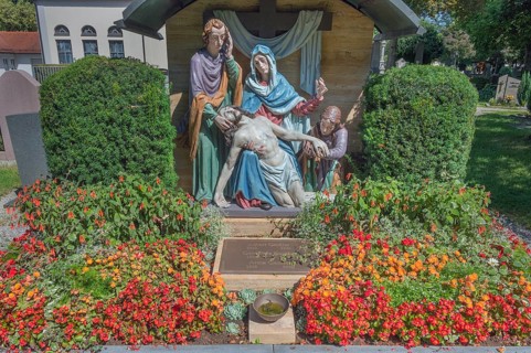 Gravesite with depiction of the Descent from the Cross and floral decoration, Catholic cemetery,