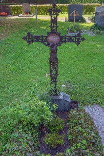 Gravesite with wrought-iron crucifix, Catholic cemetery, Kempten, Allgäu, Bavaria, Germany