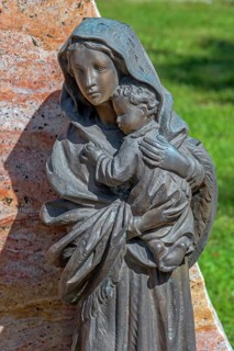 Gravesite with bronze figure, mother with child, catholic cemetery, Kempten, Allgäu, Bavaria,