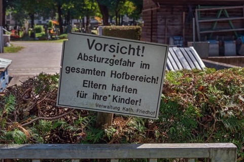 Warning sign, danger of falling, parents are liable for their children, catholic cemetery, Kempten,