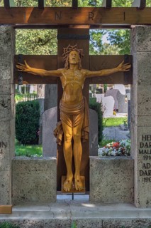 Gravesite with crucifix, catholic cemetery, Kempten, Allgäu, Bavaria, Germany
