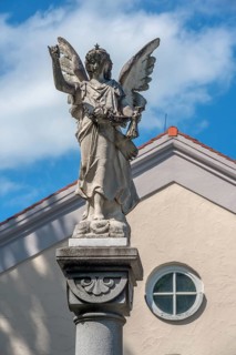 The angel on the fountain column by the funeral parlour, Catholic cemetery, Kempten, Allgäu,