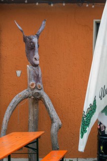 Whimsical tree sculpture, donkey's head with long ears at the Kultur-Wirtschaft in the Allgäuhalle,