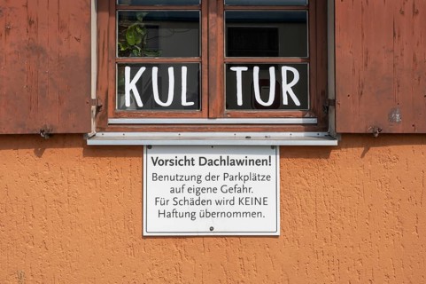 Window and warning sign Caution-roof-law, Allgäuhalle, Kempten, Allgäu, Bavaria, Germany