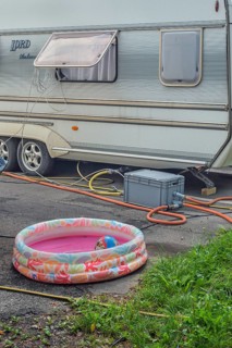 Lord Ambassador caravan with electricity and water connections and children's paddling pool at