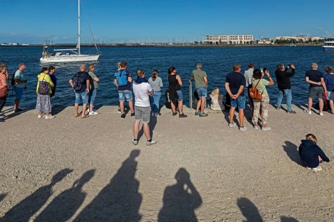 People waiting for the departure of the Aida mar, shadow, sailing boat, Unterwarnow, Warnemünde,