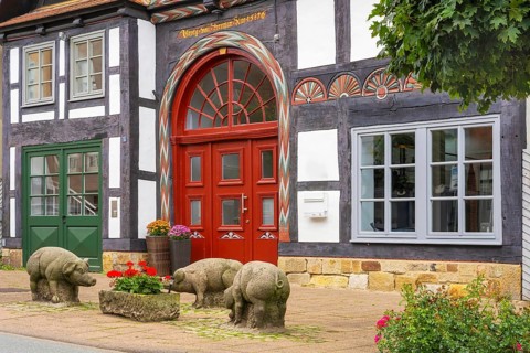 Reminder of former pig market in front of historic half-timbered house Brennerstrasse Rinteln