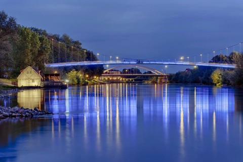 Ship mill and Weser bridges illuminated Rinteln Germany