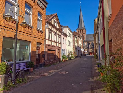 Street with bench in old town, catholic church St. Margareta, architecture, lantern, religion,