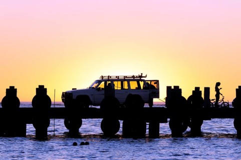 Sunset on the beach, car on a jetty near Lancelin, Perth, Western Australia, WA, Indian Ocean,