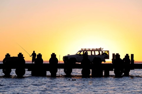 Sunset on the beach, car on a jetty near Lancelin, Perth, Western Australia, WA, Indian Ocean,
