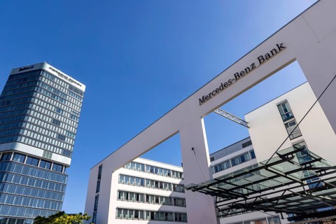 Mercedes Benz Bank Stuttgart. Exterior view with logo. On the left the Porsche Design Tower.