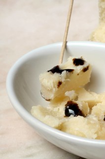 Parmesan cheese, pieces of cheese with crema di balsamico in small bowls