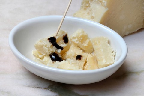 Parmesan cheese, pieces of cheese with crema di balsamico in small bowls