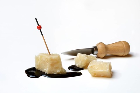 Parmesan cheese, pieces of cheese and crema di balsamico