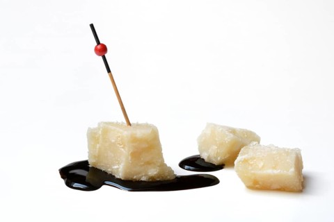 Parmesan cheese, pieces of cheese and crema di balsamico