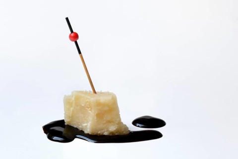 Parmesan cheese, piece of cheese with crema di balsamico