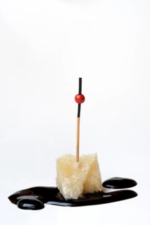 Parmesan cheese, piece of cheese with crema di balsamico