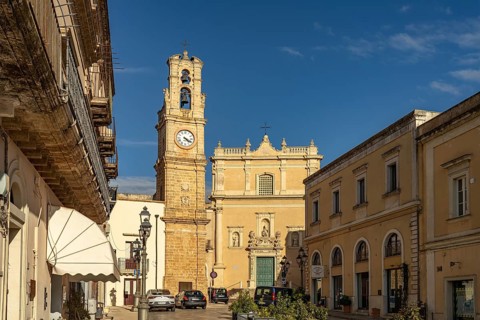 Clock tower and the church Chiesa di Maria Santissima Annunziata in Casarano, Apulia, Italy