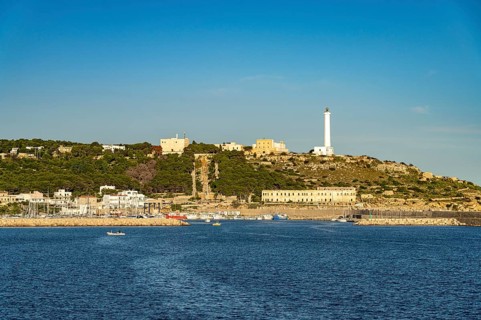 Town view with harbour and lighthouse in Santa Maria di Leuca, Apulia, Italy