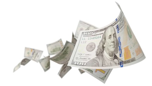 Randomly falling U.S. 100 dollar bills isolated on a white background