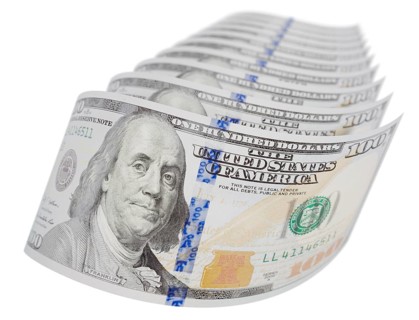 Abstract set of U.S. 100 dollar bills isolated on a white background
