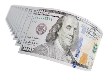 Abstract set of U.S. 100 dollar bills isolated on a white background