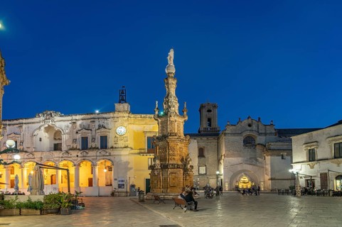 Piazza Salandra with the Guglia dell'Immacolata column and Palazzo di città at dusk, Nardo, Apulia,