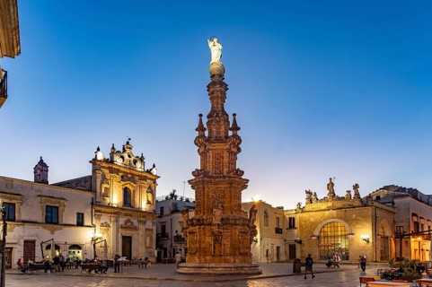 The Piazza Salandra square with the Guglia dell'Immacolata column and the Chiesa di San Trifone