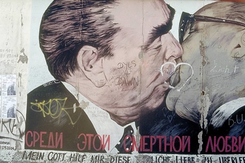 Artwork shows Leonid Brezhnev and Erich Honecker kissing, painting was created in 1990 at the