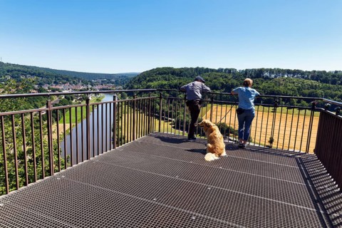 Dog walkers enjoy the view of the Weser from the Skywalk, Beverungen, Höxter, East Westphalia,
