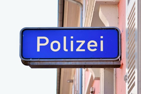Ettlingen, Germany - August 13th 2025: German police sign with the word Polizei on building