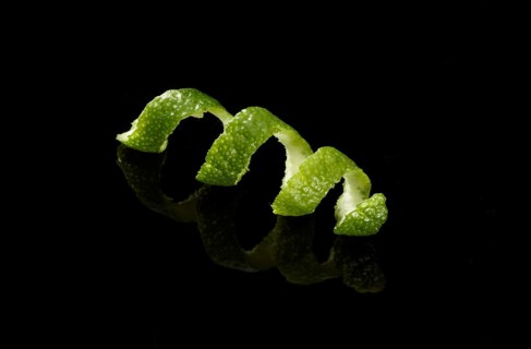 Lime zest against a black background