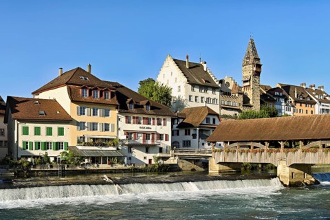 Old town with the tower of the Muri- Amthof, in the foreground the weir, the old wooden bridge over