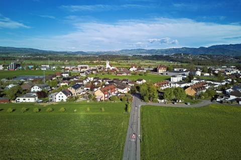 View of the village with the neighbourhood Oberdorf and the catholic parish church Mariä Geburt,