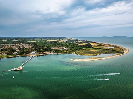 River Hamble over Warsash Maritime Academy Pier from drone, Hamble-le-Rice, Warsash, Southampton