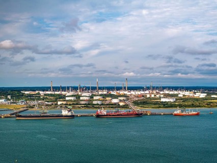 Gas tankers over refinery Esso Oil Terminal from drone, Southampton, Hampshire, England, United