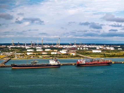 Gas tankers over refinery Esso Oil Terminal from drone, Southampton, Hampshire, England,