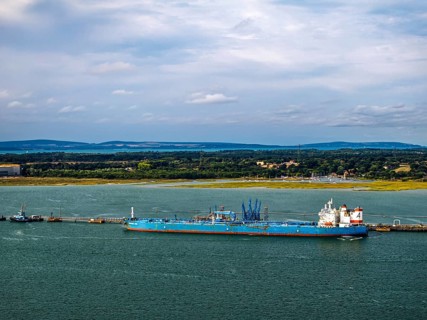 Gas tankers over refinery Esso Oil Terminal from drone, Southampton, Hampshire, England, United