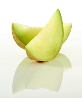 Honeydew melon, 2 melon slices in front of a white background