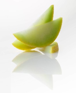 Honeydew melon, 3 melon slices against a white background