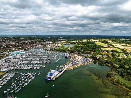 Wight Light car ferry to Isle of Wight on Lymington River and marina from drone, Lymington, New