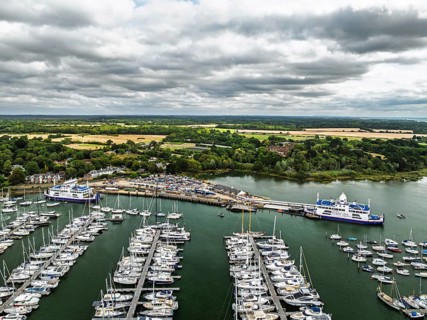 Wight Light car ferry to Isle of Wight on Lymington River and marina from drone, Lymington, New
